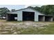 Spacious barn with multiple open bays for storage and livestock; ready for your horses and farm equipment at 259 Hwy 11, Social Circle, GA 30025
