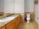 Well-lit bathroom featuring granite counters, tiled floors, and a shower with glass doors at 259 Hwy 11, Social Circle, GA 30025