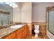 Bathroom featuring granite counters, tile floors, and a shower with glass doors at 259 Hwy 11, Social Circle, GA 30025