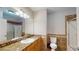 A bathroom with granite countertops, a large mirror, and tiled shower-tub combo at 259 Hwy 11, Social Circle, GA 30025