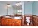 Bathroom featuring a double sink vanity with granite countertops and earth-toned tiling at 259 Hwy 11, Social Circle, GA 30025