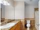Well-lit bathroom featuring a granite vanity, ample counter space, and a tiled shower at 259 Hwy 11, Social Circle, GA 30025