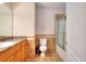 Well-lit bathroom featuring tile floors, granite counters, and shower at 259 Hwy 11, Social Circle, GA 30025