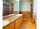 Bathroom with a double sink vanity, granite countertop, tiled floor, and glass shower at 259 Hwy 11, Social Circle, GA 30025