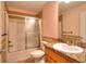 Bathroom featuring vanity with granite countertop and a shower with sliding doors at 259 Hwy 11, Social Circle, GA 30025