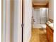 A bathroom features tile flooring, a granite countertop sink, and shower with glass doors at 259 Hwy 11, Social Circle, GA 30025