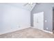 Spacious bedroom with neutral carpet, a ceiling fan, and a double door closet at 259 Hwy 11, Social Circle, GA 30025