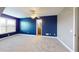Spacious bedroom featuring carpet, a ceiling fan, and large window at 259 Hwy 11, Social Circle, GA 30025
