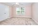 Bright bedroom with neutral walls, carpet, and a double closet at 259 Hwy 11, Social Circle, GA 30025