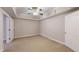 Cozy bedroom with a ceiling fan, neutral carpet and adjacent doorway at 259 Hwy 11, Social Circle, GA 30025