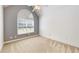 Bedroom with large arched window and ceiling fan at 259 Hwy 11, Social Circle, GA 30025