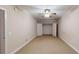Neutral bedroom features plush carpet and walk-in closet with bi-fold doors at 259 Hwy 11, Social Circle, GA 30025
