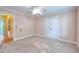 Bedroom featuring carpet and ceiling fan with two doors at 259 Hwy 11, Social Circle, GA 30025