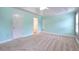 Bright primary bedroom with tray ceiling, neutral carpet, and windows at 259 Hwy 11, Social Circle, GA 30025