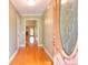 Inviting entryway featuring a hardwood floor, decorative front door and views into a warm and inviting interior at 259 Hwy 11, Social Circle, GA 30025