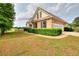 Beautiful brick house featuring manicured lawn, mature trees, and attached garage at 259 Hwy 11, Social Circle, GA 30025