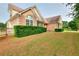 Beautiful brick home with manicured lawn and mature bushes at 259 Hwy 11, Social Circle, GA 30025