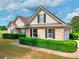 Charming brick home exterior with neat landscaping, featuring a manicured lawn and driveway at 259 Hwy 11, Social Circle, GA 30025