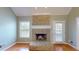 Living room fireplace with mantle and gas logs at 259 Hwy 11, Social Circle, GA 30025
