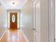 Inviting foyer with wood floors and a beautifully crafted front door with sidelights at 259 Hwy 11, Social Circle, GA 30025