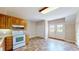 Bright kitchen featuring oak cabinets, white appliances, and double glass doors at 259 Hwy 11, Social Circle, GA 30025