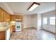 Charming kitchen featuring wood cabinets, white appliances, and an adjacent dining area with a double door exit at 259 Hwy 11, Social Circle, GA 30025
