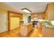 Kitchen featuring wood cabinets, granite counters, stainless steel appliances, and a center island at 259 Hwy 11, Social Circle, GA 30025