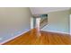 Spacious living room featuring beautiful hardwood floors and stairs leading to upper level at 259 Hwy 11, Social Circle, GA 30025