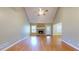 Open living room with high ceilings, a fireplace, and hardwood floors at 259 Hwy 11, Social Circle, GA 30025