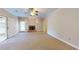 Open living room with carpet and brick fireplace at 259 Hwy 11, Social Circle, GA 30025