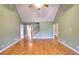 Spacious living room with hardwood flooring and vaulted ceilings creating an airy feel at 259 Hwy 11, Social Circle, GA 30025