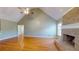 Inviting living room boasts high ceilings, hardwood floors, and a classic brick fireplace at 259 Hwy 11, Social Circle, GA 30025