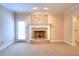 Inviting living room featuring a brick fireplace and access to the outdoors at 259 Hwy 11, Social Circle, GA 30025
