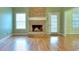 Living room with brick fireplace and hardwood floors at 259 Hwy 11, Social Circle, GA 30025