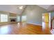 Spacious living room featuring hardwood floors, fireplace, and plenty of natural light at 259 Hwy 11, Social Circle, GA 30025