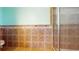 Shower featuring neutral tiling and a glass shower door at 259 Hwy 11, Social Circle, GA 30025