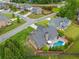 Stunning aerial view of a home with a private backyard pool and manicured landscaping at 4721 W Lakeshore Dr, Acworth, GA 30101