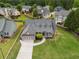 Aerial view of a landscaped home with a well-maintained front lawn and driveway at 4721 W Lakeshore Dr, Acworth, GA 30101