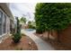 Beautifully landscaped backyard with a walkway leading to the pool and patio area at 4721 W Lakeshore Dr, Acworth, GA 30101