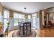 Inviting breakfast nook features wainscoting, hardwood floors and a door to the outside at 4721 W Lakeshore Dr, Acworth, GA 30101