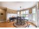 Bright breakfast nook with wainscoting and views of the pool at 4721 W Lakeshore Dr, Acworth, GA 30101
