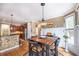 Cozy breakfast nook featuring hardwood floors and convenient kitchen access at 4721 W Lakeshore Dr, Acworth, GA 30101