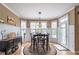 Bright breakfast nook with hardwood floors, wainscoting, and plenty of natural light at 4721 W Lakeshore Dr, Acworth, GA 30101