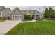 Charming single Gathering home with a manicured lawn, two-car garage, and covered front porch at 4721 W Lakeshore Dr, Acworth, GA 30101