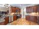 Well-equipped kitchen with granite countertops, stainless steel appliances, and wood cabinets at 4721 W Lakeshore Dr, Acworth, GA 30101