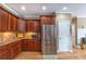 Spacious kitchen with stainless steel appliances and rich wood cabinetry at 4721 W Lakeshore Dr, Acworth, GA 30101