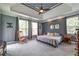Spacious main bedroom with trey ceiling, ceiling fan, neutral walls and carpet at 4721 W Lakeshore Dr, Acworth, GA 30101