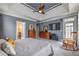 Well-lit main bedroom with trey ceiling, ceiling fan, and access to the bathroom at 4721 W Lakeshore Dr, Acworth, GA 30101