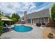 Beautiful pool area with lounge chairs, patio table and lush green landscaping at 4721 W Lakeshore Dr, Acworth, GA 30101
