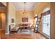 Cozy sitting room featuring hardwood floors, large windows, and comfortable seating at 4721 W Lakeshore Dr, Acworth, GA 30101